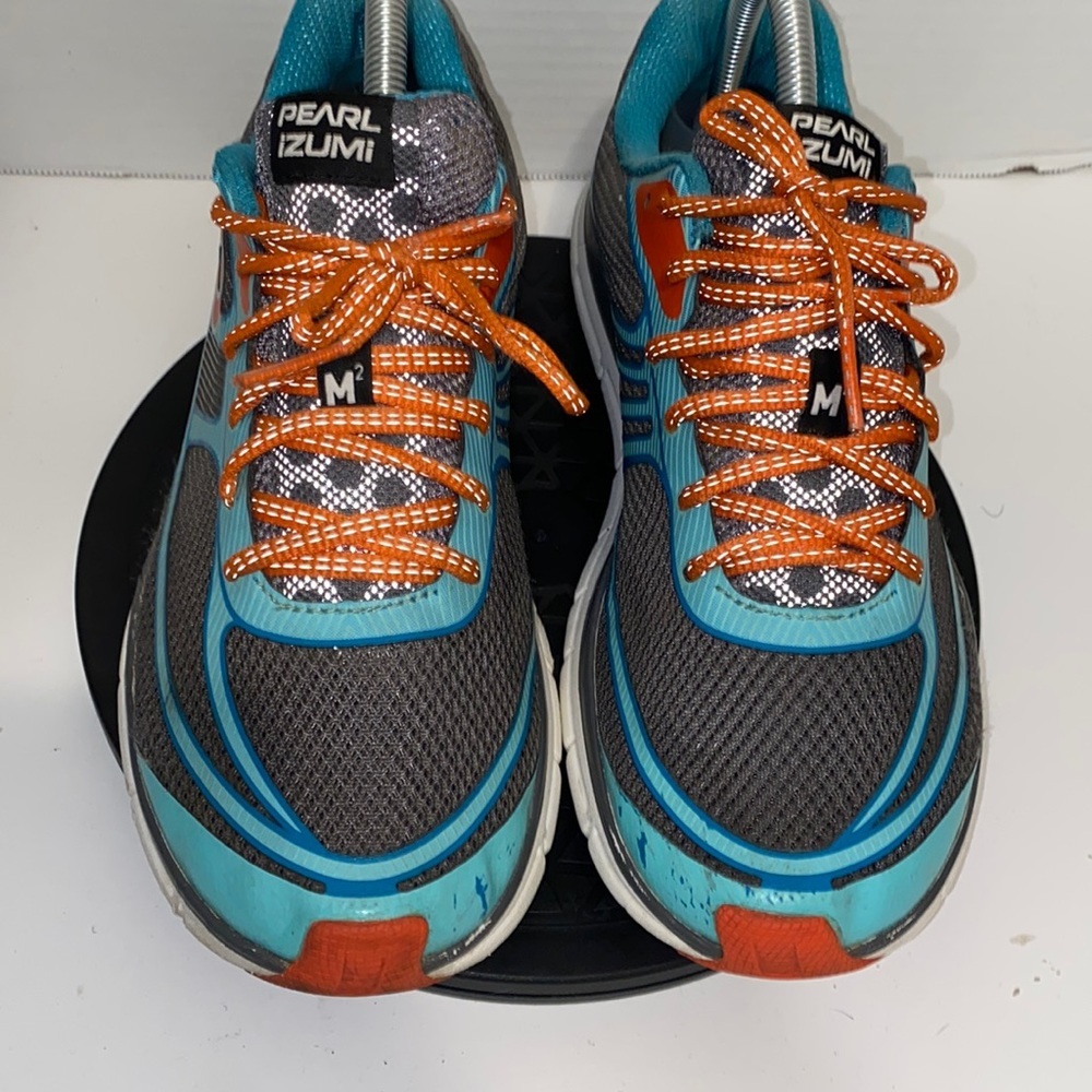 Women Pearl Izumi  size 9.5 color: Charcoal gray, orange, and  turquoise.
